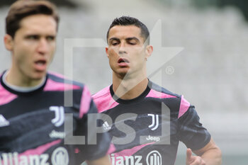 2021-04-03 - Cristiano Ronaldo (Juventus FC) and Federico Chiesa (Juventus FC) during warmup - TORINO FC VS JUVENTUS FC - ITALIAN SERIE A - SOCCER