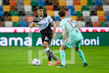 2021-04-10 - Nahuel Molina (Udinese) in action against Cristian Ansaldi (Torino) - UDINESE CALCIO VS TORINO FC - ITALIAN SERIE A - SOCCER