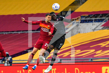 2021-04-11 - Borja Mayoral of AS Roma and Adama Soumaoro of Bologna FC seen in action during the Italian Football Championship League A 2020/2021 match between AS Roma vs Bologna FC at the Olimpic Stadium in Rome. - AS ROMA VS BOLOGNA FC - ITALIAN SERIE A - SOCCER