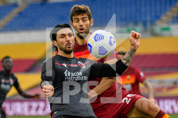 2021-04-11 - Roberto Soriano of Bologna FC and Federico Fazio of AS Roma seen in action during the Italian Football Championship League A 2020/2021 match between AS Roma vs Bologna FC at the Olimpic Stadium in Rome. - AS ROMA VS BOLOGNA FC - ITALIAN SERIE A - SOCCER