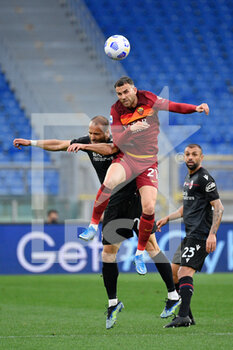 2021-04-11 - Borja Mayoral of AS Roma and Lorenzo De Silvestri of Bologna FC seen in action during the Italian Football Championship League A 2020/2021 match between AS Roma vs Bologna FC at the Olimpic Stadium in Rome. - AS ROMA VS BOLOGNA FC - ITALIAN SERIE A - SOCCER