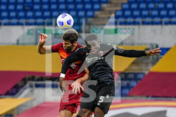 2021-04-11 - Adama Soumaoro of Bologna FC and Federico Fazio of AS Roma seen in action during the Italian Football Championship League A 2020/2021 match between AS Roma vs Bologna FC at the Olimpic Stadium in Rome. - AS ROMA VS BOLOGNA FC - ITALIAN SERIE A - SOCCER
