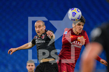 2021-04-11 - Gonzalo Villar of AS Roma and Rodrigo Palacio of Bologna FC seen in action during the Italian Football Championship League A 2020/2021 match between AS Roma vs Bologna FC at the Olimpic Stadium in Rome. - AS ROMA VS BOLOGNA FC - ITALIAN SERIE A - SOCCER
