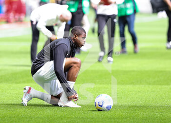 2021-04-18 - Pierre Kalulu of AC Milan warms up during the Serie A 2020/21 football match between AC Milan vs Genoa CFC at the Giuseppe Meazza Stadium, Milan, Italy on April 18, 2021 - Photo FCI / Fabrizio Carabelli - AC MILAN VS GENOA CFC - ITALIAN SERIE A - SOCCER