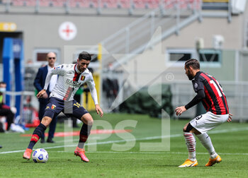 2021-04-18 - Paolo Ghiglione of Genoa CFC fights for the ball against Theo Hernandez of AC Milan during the Serie A 2020/21 football match between AC Milan vs Genoa CFC at the Giuseppe Meazza Stadium, Milan, Italy on April 18, 2021 - Photo FCI / Fabrizio Carabelli - AC MILAN VS GENOA CFC - ITALIAN SERIE A - SOCCER