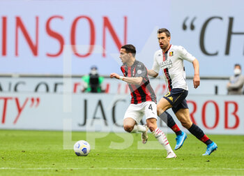 2021-04-18 - Ismael Bennacer of AC Milan and Kevin Strootman of Genoa CFC in action during the Serie A 2020/21 football match between AC Milan vs Genoa CFC at the Giuseppe Meazza Stadium, Milan, Italy on April 18, 2021 - Photo FCI / Fabrizio Carabelli - AC MILAN VS GENOA CFC - ITALIAN SERIE A - SOCCER