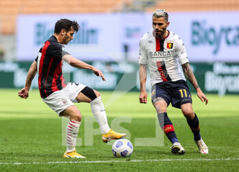 2021-04-18 - Brahim Diaz of AC Milan fights for the ball against Valon Behrami of Genoa CFC during the Serie A 2020/21 football match between AC Milan vs Genoa CFC at the Giuseppe Meazza Stadium, Milan, Italy on April 18, 2021 - Photo FCI / Fabrizio Carabelli - AC MILAN VS GENOA CFC - ITALIAN SERIE A - SOCCER