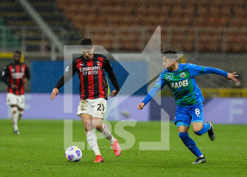 2021-04-21 - Brahim Diaz of AC Milan fights for the ball against Maxime Lopez of US Sassuolo during the Serie A 2020/21 football match between AC Milan vs US Sassuolo at Giuseppe Meazza Stadium, Milan, Italy on April 21, 2021 - Photo FCI / Fabrizio Carabelli - AC MILAN VS US SASSUOLO - ITALIAN SERIE A - SOCCER