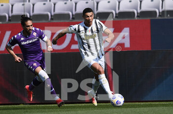 2021-04-25 - Cristiano Ronaldo of Juventus FC in action against Martin Caceres of ACF Fiorentina  - ACF FIORENTINA VS JUVENTUS FC - ITALIAN SERIE A - SOCCER