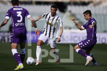 2021-04-25 - cristiano Ronaldo of Juventus FC in action against Martinez Quarta of ACF Fiorentina  - ACF FIORENTINA VS JUVENTUS FC - ITALIAN SERIE A - SOCCER