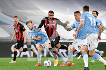 2021-04-26 - Theo Hernandez of AC Milan and Francesco Acerbi of SS Lazio seen in action during the Italian Football Championship League A 2020/2021 match between SS Lazio vs AC Milan at the Olimpic Stadium in Rome. - SS LAZIO VS AC MILAN - ITALIAN SERIE A - SOCCER