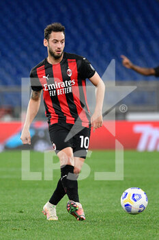 2021-04-26 - Hakan Calhanoglu of AC Milan seen in action during the Italian Football Championship League A 2020/2021 match between SS Lazio vs AC Milan at the Olimpic Stadium in Rome. - SS LAZIO VS AC MILAN - ITALIAN SERIE A - SOCCER