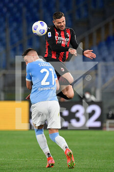 2021-04-26 - Theo Hernandez of AC Milan and Sergej Milinkovic-Savic of SS Lazio seen in action during the Italian Football Championship League A 2020/2021 match between SS Lazio vs AC Milan at the Olimpic Stadium in Rome. - SS LAZIO VS AC MILAN - ITALIAN SERIE A - SOCCER