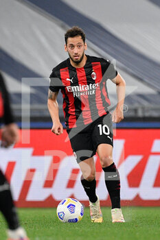 2021-04-26 - Hakan Calhanoglu of AC Milan seen in action during the Italian Football Championship League A 2020/2021 match between SS Lazio vs AC Milan at the Olimpic Stadium in Rome. - SS LAZIO VS AC MILAN - ITALIAN SERIE A - SOCCER