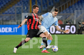 2021-04-26 - Mario Mandzukic of AC Milan and Francesco Acerbi of SS Lazio seen in action during the Italian Football Championship League A 2020/2021 match between SS Lazio vs AC Milan at the Olimpic Stadium in Rome. - SS LAZIO VS AC MILAN - ITALIAN SERIE A - SOCCER