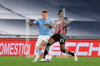 2021-04-26 - Fikayo Tomori of AC Milan and Ciro Immobile of SS Lazio seen in action during the Italian Football Championship League A 2020/2021 match between SS Lazio vs AC Milan at the Olimpic Stadium in Rome. - SS LAZIO VS AC MILAN - ITALIAN SERIE A - SOCCER