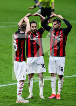 2021-05-01 - Theo Hernandez of AC Milan, Alexis Saelemaekers of AC Milan and Hakan Calhanoglu of AC Milan celebrate a goal during the Serie A 2020/21 football match between AC Milan vs Benevento Calcio at Giuseppe Meazza Stadium, Milan, Italy on May 01, 2021 - Photo FCI / Fabrizio Carabelli - AC MILAN VS BENEVENTO CALCIO - ITALIAN SERIE A - SOCCER