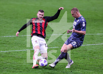 2021-05-01 - Ante Rebic of AC Milan fights for the ball against Kamil Glik of Benevento Calcio during the Serie A 2020/21 football match between AC Milan vs Benevento Calcio at Giuseppe Meazza Stadium, Milan, Italy on May 01, 2021 - Photo FCI / Fabrizio Carabelli - AC MILAN VS BENEVENTO CALCIO - ITALIAN SERIE A - SOCCER