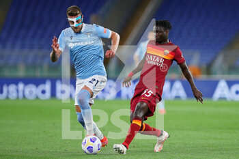 2021-05-15 - Sergej Milinkovic Savic of Lazio (L) vies for the ball with Ebrima Darboe of Roma (R) during the Italian championship Serie A football match between AS Roma and SS Lazio on May 15, 2021 at Stadio Olimpico in Rome, Italy - Photo Federico Proietti / DPPI - AS ROMA VS SS LAZIO - ITALIAN SERIE A - SOCCER