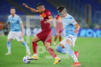 2021-05-15 - Bruno Peres of Roma (L) vies for the ball with Sergej Milinkovic Savic of Lazio during the Italian championship Serie A football match between AS Roma and SS Lazio on May 15, 2021 at Stadio Olimpico in Rome, Italy - Photo Federico Proietti / DPPI - AS ROMA VS SS LAZIO - ITALIAN SERIE A - SOCCER