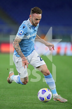 2021-05-15 - Manuel Lazzari of Lazio in action during the Italian championship Serie A football match between AS Roma and SS Lazio on May 15, 2021 at Stadio Olimpico in Rome, Italy - Photo Federico Proietti / DPPI - AS ROMA VS SS LAZIO - ITALIAN SERIE A - SOCCER