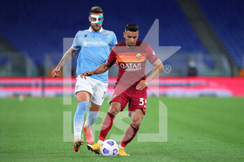 2021-05-15 - Sergej Milinkovic Savic of Lazio (L) vies for the ball with Bruno Peres of Roma (R) during the Italian championship Serie A football match between AS Roma and SS Lazio on May 15, 2021 at Stadio Olimpico in Rome, Italy - Photo Federico Proietti / DPPI - AS ROMA VS SS LAZIO - ITALIAN SERIE A - SOCCER