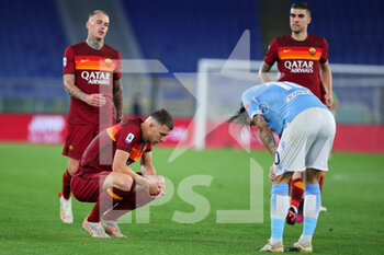 2021-05-15 - Edin Dzeko of Roma (L) and Luis Alberto of Lazio (R) react during the Italian championship Serie A football match between AS Roma and SS Lazio on May 15, 2021 at Stadio Olimpico in Rome, Italy - Photo Federico Proietti / DPPI - AS ROMA VS SS LAZIO - ITALIAN SERIE A - SOCCER