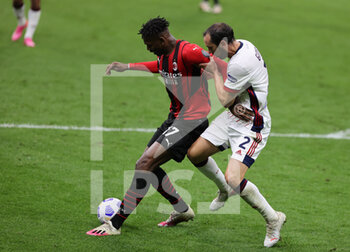 2021-05-16 - Rafael Leao of AC Milan fights for the ball against Diego Godin of Cagliari Calcio during the Serie A 2020/21 football match between AC Milan vs Cagliari Calcio at Giuseppe Meazza Stadium, Milan, Italy on May 16, 2021 - Photo FCI / Fabrizio Carabelli - AC MILAN VS CAGLIARI CALCIO - ITALIAN SERIE A - SOCCER