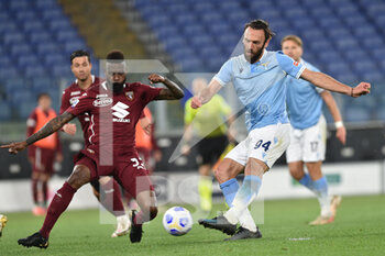 2021-05-18 - Nicolas Nkoulou (Torino ) Vedat Muriqi (Lazio) - SS LAZIO VS TORINO FC - ITALIAN SERIE A - SOCCER