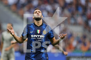 2021-08-21 - Hakan Calhanoglu of FC Internazionale reacts during the Serie A 2021/22 football match between FC Internazionale and Genoa CFC at Giuseppe Meazza Stadium, Milan, Italy on August 21, 2021 - Photo FCI / Fabrizio Carabelli - INTER - FC INTERNAZIONALE VS GENOA CFC - ITALIAN SERIE A - SOCCER