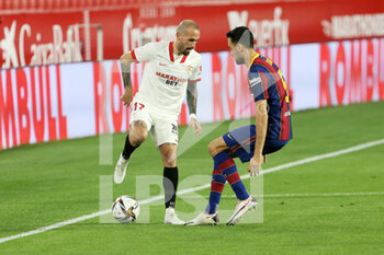 2021-02-10 - Aleix Vidal of FC Sevilla and Sergio Busquets of FC Barcelona during the Spanish Cup, Copa del Rey, semi final, 1st leg football match between FC Sevilla and FC Barcelona on February 10, 2021 at Sanchez Pizjuan stadium in Sevilla, Spain - Photo Laurent Lairys / DPPI - SEMI FINAL - FC SEVILLA AND FC BARCELONA - SPANISH CUP - SOCCER