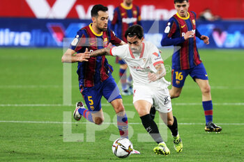 2021-02-10 - Suso of FC Sevilla and Sergio Busquets of FC Barcelona during the Spanish Cup, Copa del Rey, semi final, 1st leg football match between FC Sevilla and FC Barcelona on February 10, 2021 at Sanchez Pizjuan stadium in Sevilla, Spain - Photo Laurent Lairys / DPPI - SEMI FINAL - FC SEVILLA AND FC BARCELONA - SPANISH CUP - SOCCER