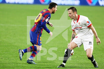 2021-02-10 - Lionel Messi of FC Barcelona and Ivan Rakitic of FC Sevilla during the Spanish Cup, Copa del Rey, semi final, 1st leg football match between FC Sevilla and FC Barcelona on February 10, 2021 at Sanchez Pizjuan stadium in Sevilla, Spain - Photo Laurent Lairys / DPPI - SEMI FINAL - FC SEVILLA AND FC BARCELONA - SPANISH CUP - SOCCER