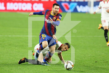 2021-02-10 - Lionel Messi of FC Barcelona and Joan Jordan of FC Sevilla during the Spanish Cup, Copa del Rey, semi final, 1st leg football match between FC Sevilla and FC Barcelona on February 10, 2021 at Sanchez Pizjuan stadium in Sevilla, Spain - Photo Laurent Lairys / DPPI - SEMI FINAL - FC SEVILLA AND FC BARCELONA - SPANISH CUP - SOCCER
