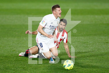 2020-12-15 - Toni Kroos of Real Madrid is fouled by Raul Garcia of Athletic Club during the Spanish championship La Liga football match between Real Madrid and Athletic Club de Bilbao on december 15, 2020 at Alfredo di Stefano stadium in Valdebebas near Madrid, Spain - Photo Oscar J Barroso / Spain DPPI / DPPI - REAL MADRID VS ATHLETIC CLUB DE BILBAO - SPANISH LA LIGA - SOCCER
