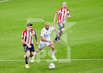 2020-12-18 - Mikel Rico of SD Huesca and Yuri Berchiche of Athletic Club during the Spanish championship La Liga football match between Athletic Club and SD Huesca on December 18, 2020 at San Mames stadium in Bilbao, Spain - Photo Inigo Larreina / Spain DPPI / DPPI - ATHLETIC CLUB VS SD HUESCA - SPANISH LA LIGA - SOCCER