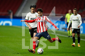 2021-01-24 - Joao Felix of Atletico de Madrid and Carlos Soler of Valencia in action during the Spanish championship La Liga football match between Atletico de Madrid and Valencia CF on january 24, 2021 at Wanda Metropolitano stadium in Madrid, Spain - Photo Oscar J Barroso / Spain DPPI / DPPI - ATLETICO DE MADRID AND VALENCIA CF - SPANISH LA LIGA - SOCCER
