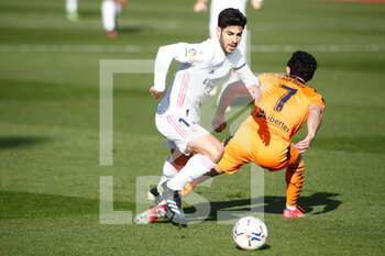 2021-02-14 - Marco Asensio of Real Madrid and Goncalo Guedes of Valencia during the Spanish championship La Liga football match between Real Madrid and Valencia CF on february 14, 2021 at Ciudad Deportiva Real Madrid in Valdebebas, Madrid, Spain - Photo Oscar J Barroso / Spain DPPI / DPPI - REAL MADRID AND VALENCIA CF - SPANISH LA LIGA - SOCCER