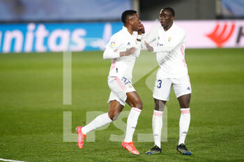 2021-03-01 - Vinicius Junior of Real Madrid celebrates a goal with Ferland Mendy during the Spanish championship La Liga football match between Real Madrid and Real Sociedad on March 1, 2021 at Alfredo Di Stefano stadium in Valdebebas near Madrid, Spain - Photo Oscar J Barroso / Spain DPPI / DPPI - REAL MADRID AND REAL SOCIEDAD - SPANISH LA LIGA - SOCCER