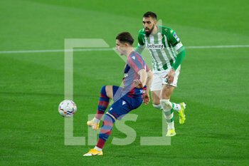 2021-03-19 - Enis Bardhi of Levante and Borja Iglesias of Real Betis during the Spanish championship La Liga football match between Real Betis Balompie and Levante Union Deportiva on March 19, 2021 at Benito Villamarin Stadium in Sevilla, Spain - Photo Joaquin Corchero / Spain DPPI / DPPI - REAL BETIS BALOMPIE AND LEVANTE UNION DEPORTIVA - SPANISH LA LIGA - SOCCER