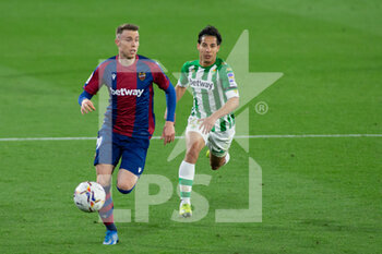 2021-03-19 - Carlos Clerc of Levante and Diego Lainez of Real Betis during the Spanish championship La Liga football match between Real Betis Balompie and Levante Union Deportiva on March 19, 2021 at Benito Villamarin Stadium in Sevilla, Spain - Photo Joaquin Corchero / Spain DPPI / DPPI - REAL BETIS BALOMPIE AND LEVANTE UNION DEPORTIVA - SPANISH LA LIGA - SOCCER