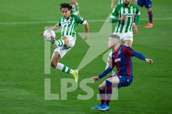 2021-03-19 - Diego Lainez of Real Betis and Carlos Clerc of Levante during the Spanish championship La Liga football match between Real Betis Balompie and Levante Union Deportiva on March 19, 2021 at Benito Villamarin Stadium in Sevilla, Spain - Photo Joaquin Corchero / Spain DPPI / DPPI - REAL BETIS BALOMPIE AND LEVANTE UNION DEPORTIVA - SPANISH LA LIGA - SOCCER