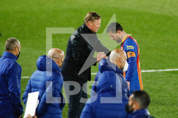 2021-04-10 - Ronald Koeman, coach of FC Barcelona with Lionel Messi after the Spanish championship La Liga football match between Real Madrid and FC Barcelona on April 10, 2021 at Alfredo Di Stefano stadium in Madrid, Spain - Photo Oscar J Barroso / Spain DPPI / DPPI - REAL MADRID VS FC BARCELONA - SPANISH LA LIGA - SOCCER