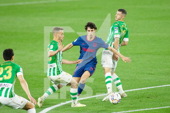 2021-04-11 - Joao Felix of Atletico and Sergio Canales of Real Betis during the Spanish championship La Liga football match between Real Betis Balompie and Atletico de Madrid on April 11, 2021 at Benito Villamarin Stadium in Sevilla, Spain - Photo Joaquin Corchero / Spain DPPI / DPPI - REAL BETIS BALOMPIE VS ATLETICO DE MADRID - SPANISH LA LIGA - SOCCER