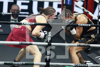 2021-03-05 - Verena Kaiser of Germany and Estelle Yoka-Mossely of France during the IBO Lightweight World championship boxing event between Estelle Mossely-Yoka and Verena Kaiser on March 5, 2021 at the H Arena in Nantes, France - Photo Laurent Lairys / DPPI - ESTELLE MOSSELY-YOKA VS VERENA KAISER - BOXING - CONTACT
