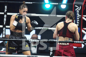 2021-03-05 - Estelle Yoka-Mossely of France and Verena Kaiser of Germany during the IBO Lightweight World championship boxing event between Estelle Mossely-Yoka and Verena Kaiser on March 5, 2021 at the H Arena in Nantes, France - Photo Laurent Lairys / DPPI - ESTELLE MOSSELY-YOKA VS VERENA KAISER - BOXING - CONTACT