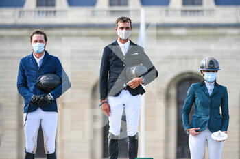 2021-07-11 - Nicolas Delmotte of France, Martin Fuchs of Switzerland (l) and Marie Demonte of France (r) during the winners podium ceremony during the Rolex Grand Prix Table A against the clock 1m60 with jump off, of the Masters Chantilly 2021, FEI equestrian event, Jumping CSI5 on July 11, 2021 at Chateau de Chantilly in Chantilly, France - Photo Victor Joly / DPPI - MASTERS CHANTILLY 2021, FEI EQUESTRIAN EVENT, JUMPING CSI5 - INTERNATIONALS - EQUESTRIAN