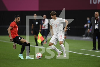 2021-07-22 - Taher MOHAMED (EGY) Juan MIRANDA (ESP) during the Olympic Games Tokyo 2020, Football Men's First Round Group C, between Egypt and Spain on July 22, 2021 at Sapporo Dome in Sapporo, Japan - Photo Photo Kishimoto / DPPI - OLYMPIC GAMES TOKYO 2020, JULY 22, 2021 - OLYMPIC GAMES TOKYO 2020 - OLYMPIC GAMES