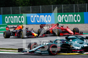 2021-07-04 - PEREZ Sergio (mex), Red Bull Racing Honda RB16B, LECLERC Charles (mco), Scuderia Ferrari SF21, action during the Formula 1 Grosser Preis Von Osterreich 2021, 2021 Austrian Grand Prix, 9th round of the 2021 FIA Formula One World Championship from July 2 to 4, 2021 on the Red Bull Ring, in Spielberg, Austria - Photo Florent Gooden / DPPI - FORMULA 1 GROSSER PREIS VON OSTERREICH 2021, 2021 AUSTRIAN GRAND PRIX - FORMULA 1 - MOTORS