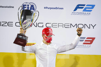 2020-12-06 - Schumacher Mick (ger), Prema Racing, Dallara F2 2018, portrait, celebrating his title during the F2 & F3 Prize giving Ceremony of the 2020 season, December 6, 2020 on the Bahrain International Circuit, in Sakhir, Bahrain - Photo Florent Gooden / DPPI - 12TH ROUND OF THE 2020 FIA FORMULA 2 CHAMPIONSHIP - SUNDAY - FORMULA 2 - MOTORS